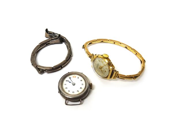 A lady's 9ct gold cased Certina wristwatch, the signed circular silvered dial with gilt Arabic numerals and with subsidiary seconds, on a 9ct gold spr
