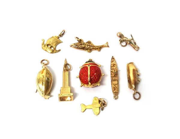NIne gold charms, comprising; four ships and boats, a fish, a ladybird, an aeroplane, a soldier and a building, various carats, combined gross weight