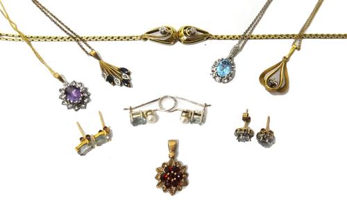 A 9ct gold bracelet, the front mounted with two circular cut diamonds, a gold and garnet set cluster pendant, designed as a flowerhead, four further p