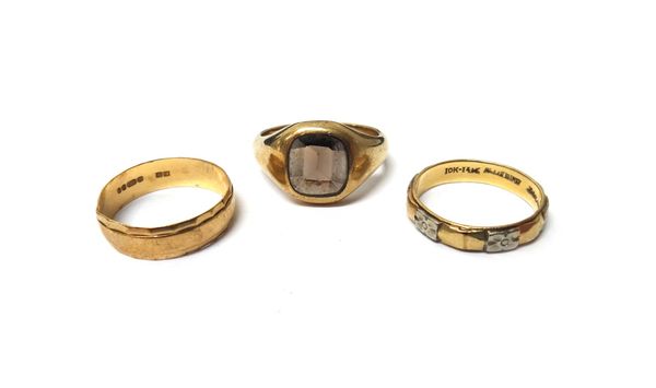 A 9ct gold and smoky quartz set signet style ring, a 9ct gold decorated wedding ring and a two colour gold decorated wedding ring, detailed 10 K-14 K,