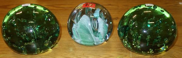 A group of three green glass dump weights with bubble inclusions (3). CAB