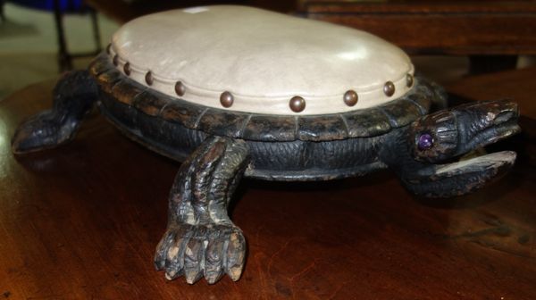 A carved footstool in the form of a turtle.  I5