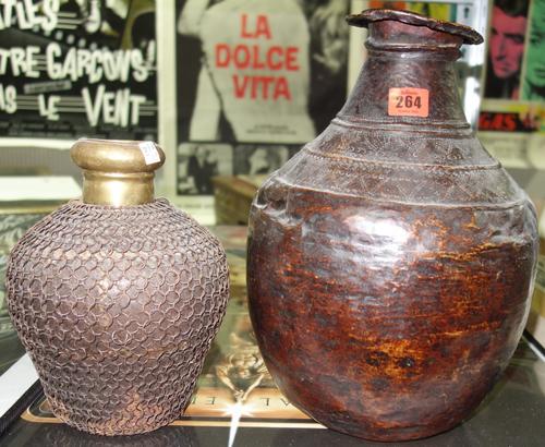 An embossed bronze vase probably 18th century and a smaller chain covered vase, (2),  A7