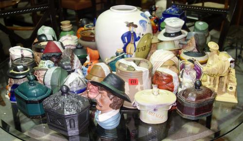 A quantity of pottery tobacco jars including Doulton, Majolica figural and other examples (qty).  S2B