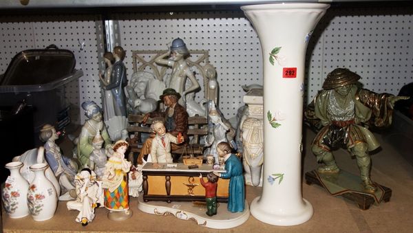 A quantity of 20th century Lladro and Nao style figures, (qty). S1M