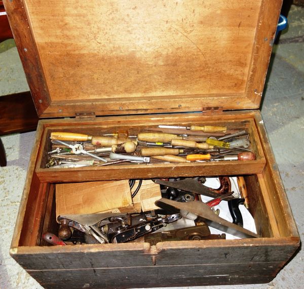 A quantity of assorted carpentry tools contained in a pine trunk. DIS