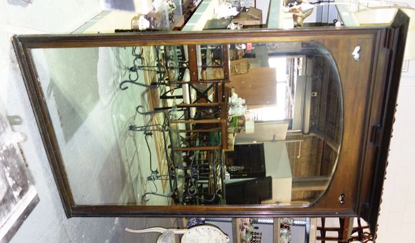 A large early 20th century mahogany wall mirror with arched mirror plate and pierced heart motifs. S3 END