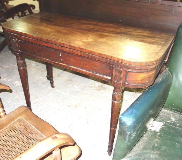A 19th century mahogany fold over card table.   G3