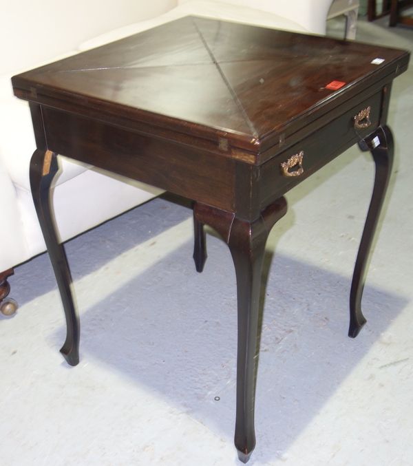 A 19th century walnut envelope four fold card table,  56cm wide.  D2