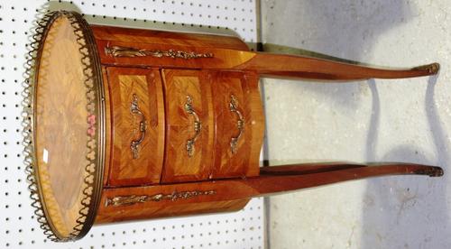 An oval Kingwood and inlaid three drawer side table, 33cm wide.   B3
