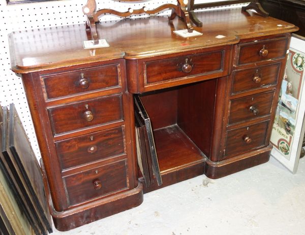 A Victorian mahogany kneehole desk with nine drawers about the knee, 123cm wide.