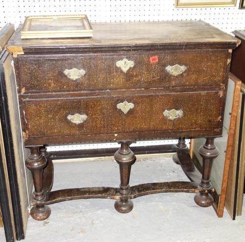 A 17th century style oak chest of two short and two long drawers, 96cm wide.