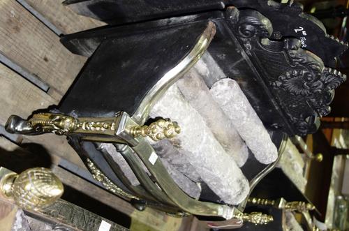A serpentine steel iron and brass fire basket. DISPLAY