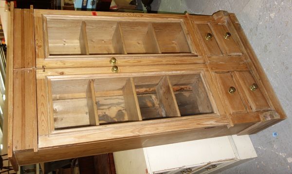 A 20th century pine two door glazed cupboard.   DIS
