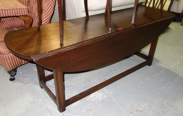 A large 20th century oak drop flap coffee table.   E3