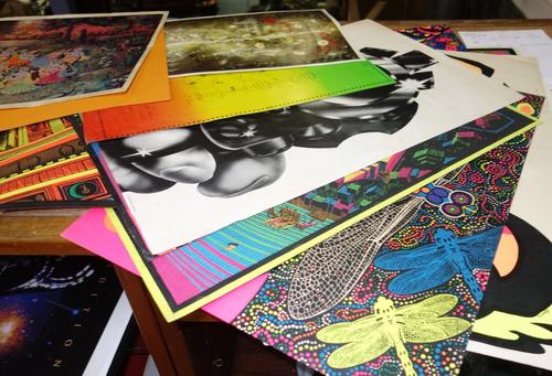 A quantity of rock and pop posters. SH4