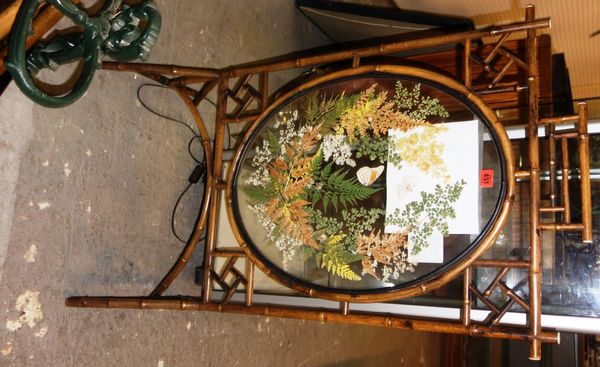 A Victorian bamboo fire screen, with oval glazed panels.  DIS