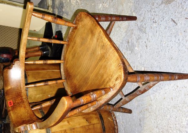 A late 19th century mahogany and elm smoker's bow armchair, on turned supports.   E3