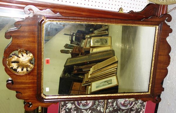 A George III parcel gilt fret cut wall mirror, 62cm wide x 102cm high.  A4