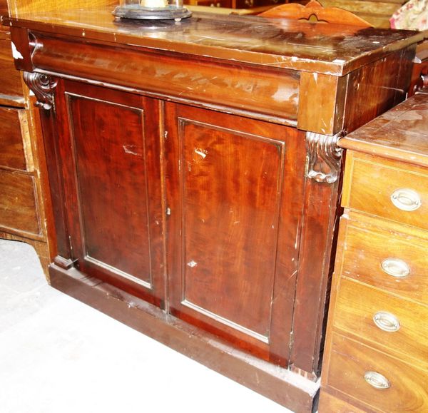 A Victorian mahogany chiffonier with cushion drawer over cupboard.  DIS