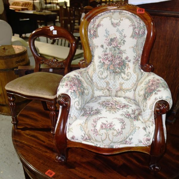 An upholstered child's armchair and a mahogany small child's balloon back chair, (2). I5