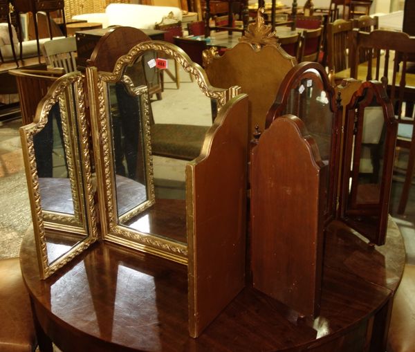 A group of three triptych mirrors and an oval toilet mirror, (4).   G4