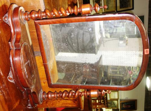 A Victorian mahogany swing framed arch top mirror.  K4