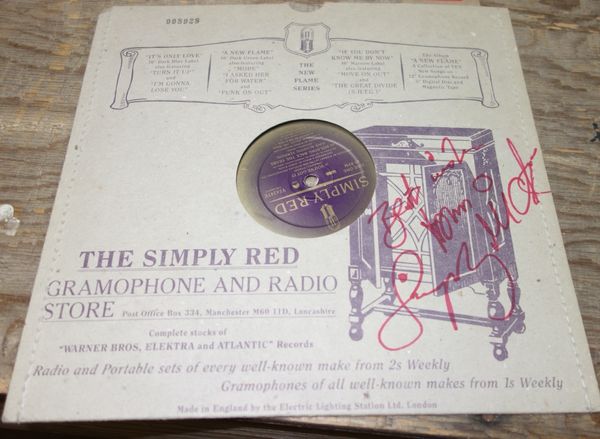 A Simply Red 45rpm record, signed.All potential purchasers should satisfy themselves with authenticity of signatures.