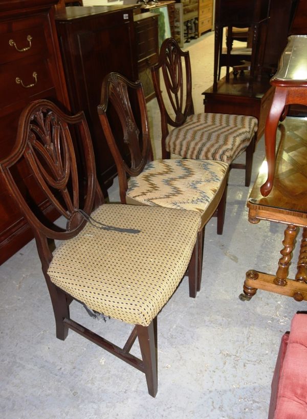 A pair of 18th century mahogany dining chairs and another similar, (3).  L2