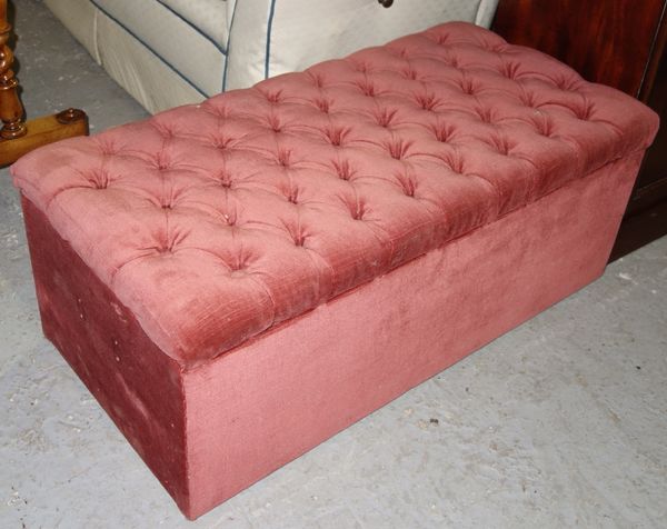 A pink button upholstered Ottoman.   L3
