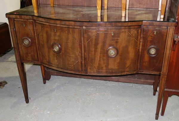 A George III inlaid mahogany bowfront sideboard, with a pair of cellarette frieze drawers flanked by smaller, on tapering square supports, 137cm wide.