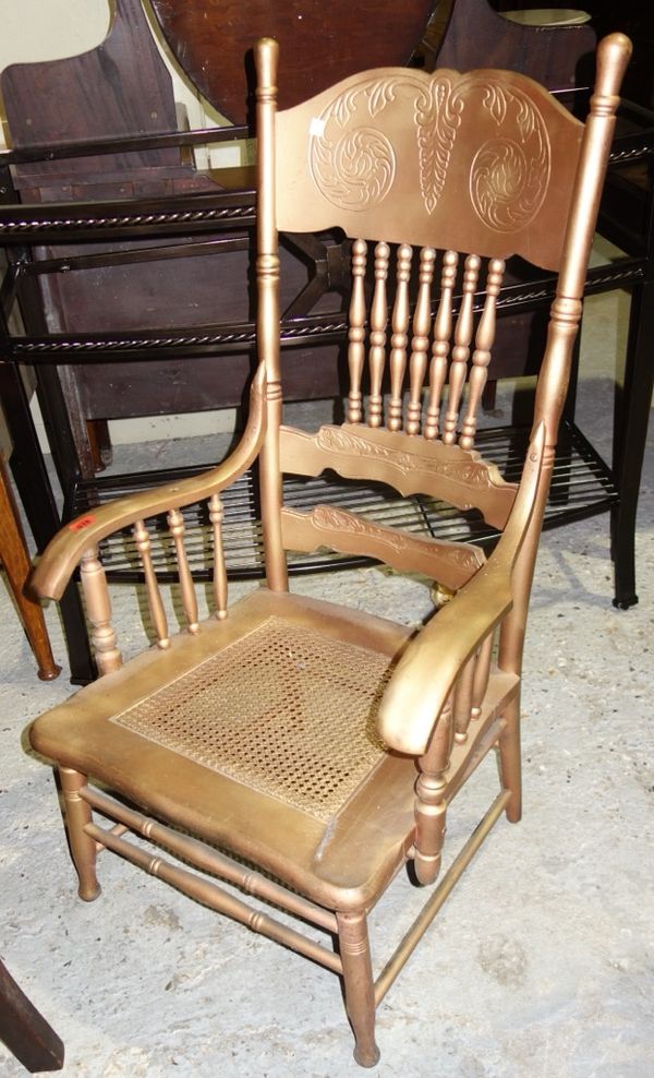 A 20th century gilt framed spindle back open armchair.  F3