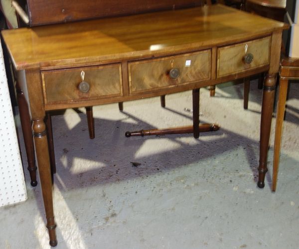 An early Victorian mahogany bowfront three drawer writing table, 106cm wide.   J5