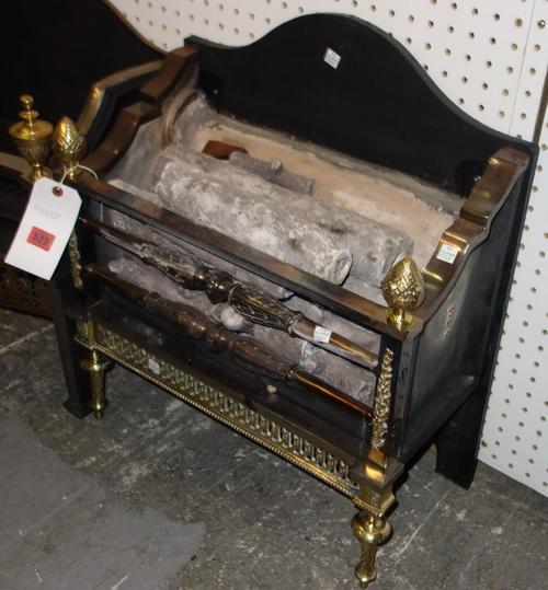 A iron steel and brass fire grate with acorn finials. DISPLAY