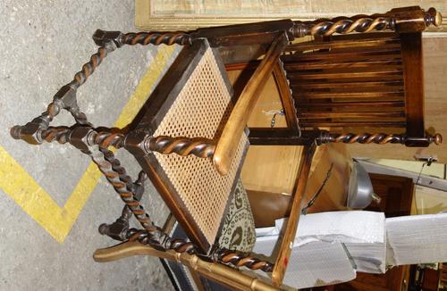 A 20th century walnut stick back open armchair.   J6