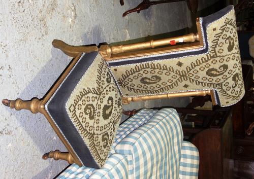 A 19th century gilt painted and needlework upholstered prie dieu chair.   G2