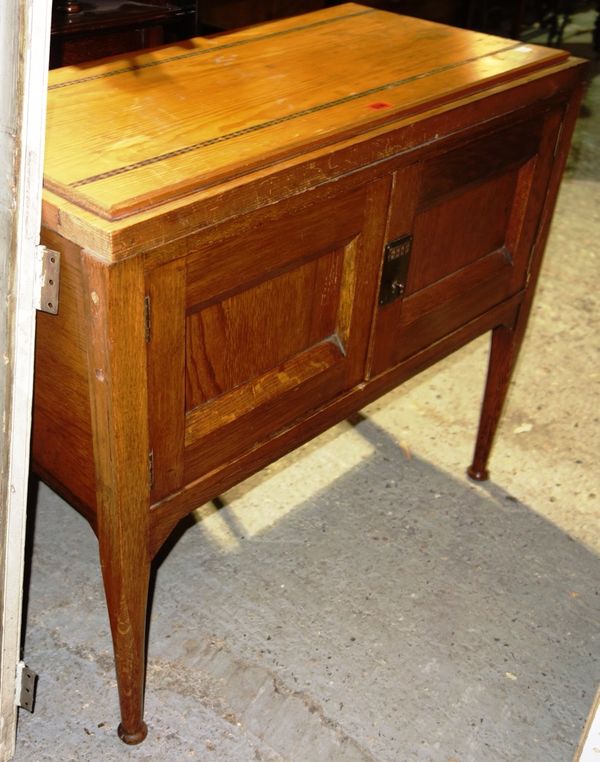 A 20th century oak and inlaid two door side cupboard.  L3