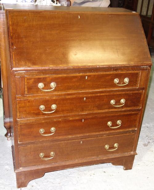 A mahogany and line inlaid bureau.  L5