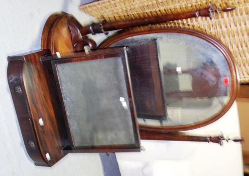 A large early Victorian figured walnut swing frame toilet mirror, on double bow base and compressed melon feet, 84cm wide x 97cm high, together with a