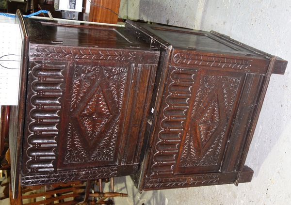 A 18th century and later made-up carved oak double height cupboard.   J5