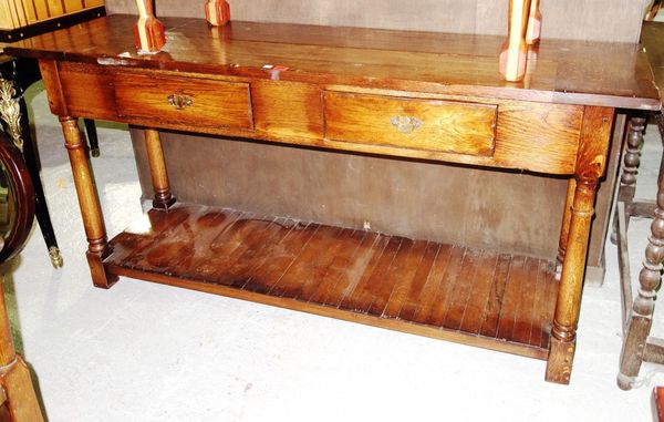 A 20th century oak three drawer sideboard, 160cm wide.  dis