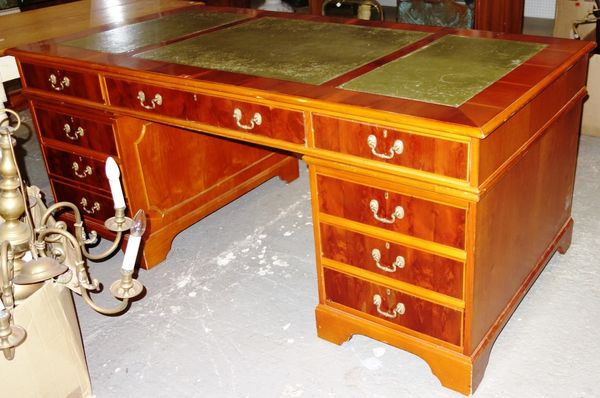 A 20th century yew wood pedestal desk, 186cm wide. DIS