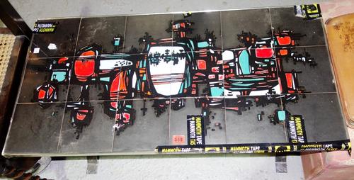 A 20th century tile topped coffee table with chrome base, 93cm wide.  J6