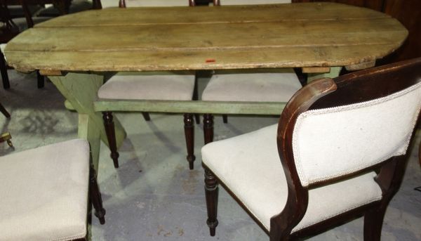A 19th century scrubbed pine tavern table, on painted 'X' frame dual supports, 156cm wide.   G5
