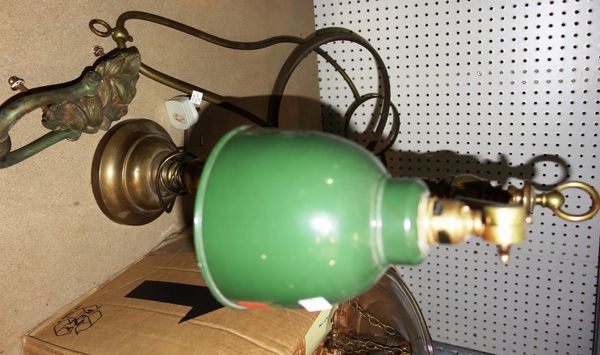 A lacquered brass table lamp, a hanging oil lamp and a lion's head door knocker, (3). S2B