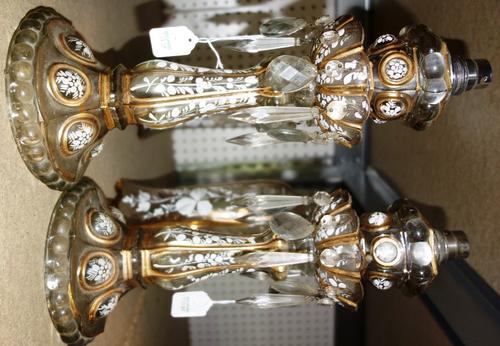 A pair of gilt and enamel glass lustre table lamps, 20th century, with matched foliate decorated glass shades, 56cm high overall, (2). S1T