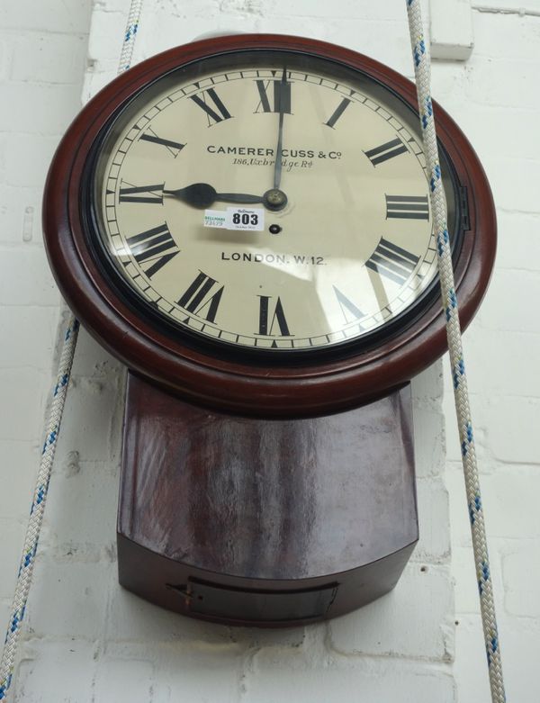 A mahogany cased drop dial wall clock, late 19th century, the eleven and a half inch white dial detailed 'Camerer Cuss & Co, 186 Uxbridge Road, London