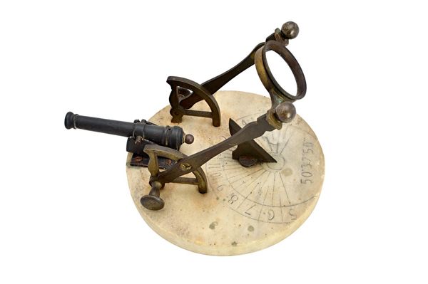 A French bronze and marble cannon sundial or noon day gun, circa 1820, the circular plate calibrated with hours with an applied gnomon cannon, 19.5cm