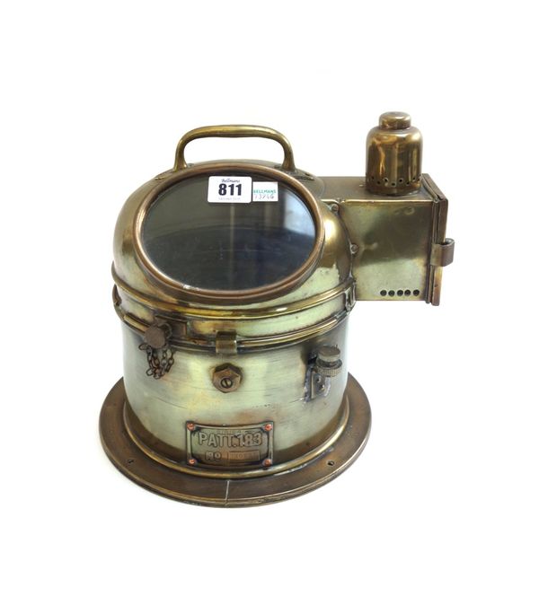 A ship's brass binnacle hood gimbal compass, early 20th century, with oil lamp illumination port to the side, ' PAT 183 No 14988B', 26.5cm.