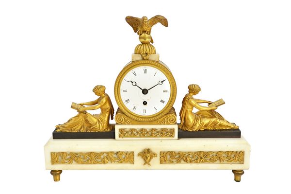 An English Regency bronze and white marble mantel clock, with eagle surmount over an enamelled dial flanked by two classical maidens reading a book, e